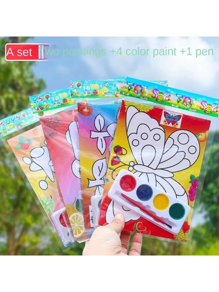 A set of DIY cartoon coloring painting kit for kids with four colors and a pen shown outdoors.