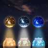 Three versions of a projector night light showing yellow, white, and blue lights with starry sky patterns.