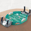 A portable tabletop foosball game featuring a green playing field and gray rods on a wooden surface.