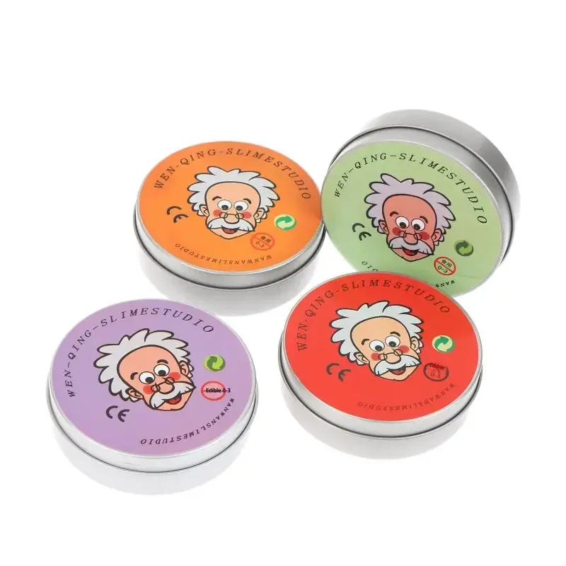 Three round glass containers of slime with citrus and fruit-themed designs.