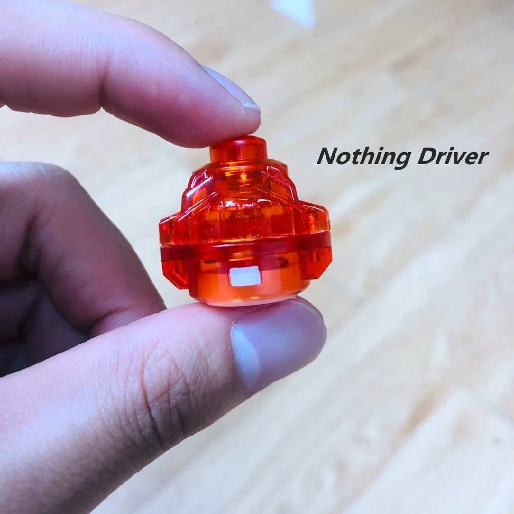 A hand holds an orange Nothing Driver component, a gyro driver for spinning tops.