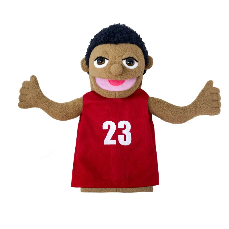 A plush hand puppet of a smiling Black boy wearing a red shirt with the number 23.