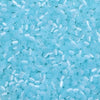 A close-up view of a mix of small, translucent light blue glass beads for jewelry making.