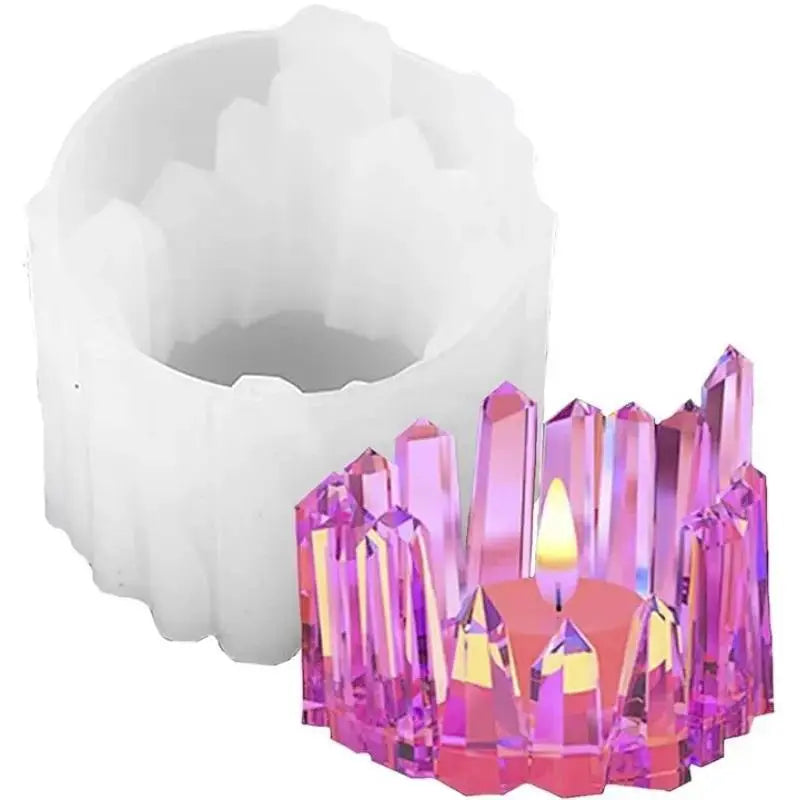 A silicone candle mold shaped like a pink crystal or flame, used for DIY resin crafts.