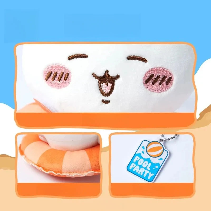 A white plush keychain charm shaped like a cute animal face with pink accents, featuring a swimming ring design.