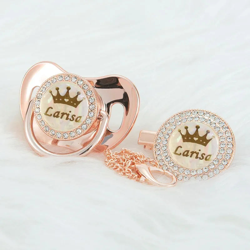 Personalized rose gold crown pacifier and clip set with a pearl and diamond design