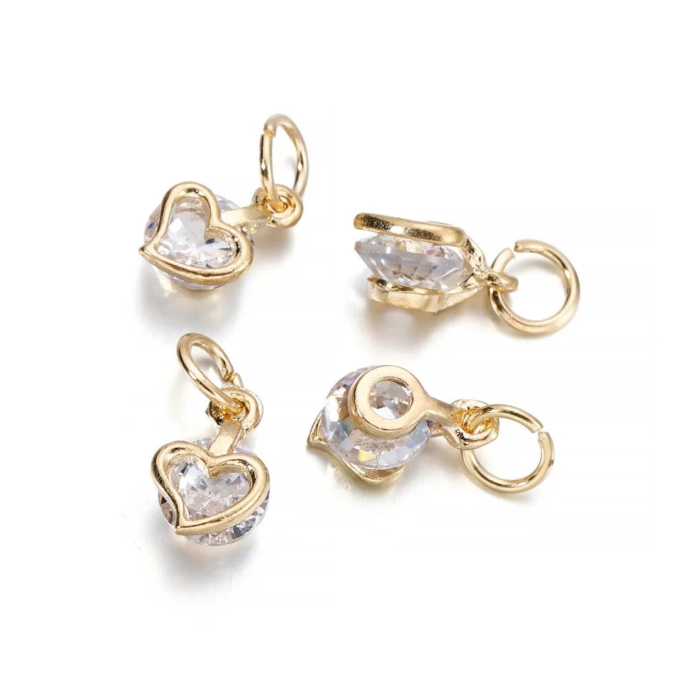 Gold-toned rhinestone heart charms for jewelry making, shown as separate pieces.