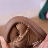 A close-up of brown cozy winter snow boots for toddlers showing the interior lining and stitching.