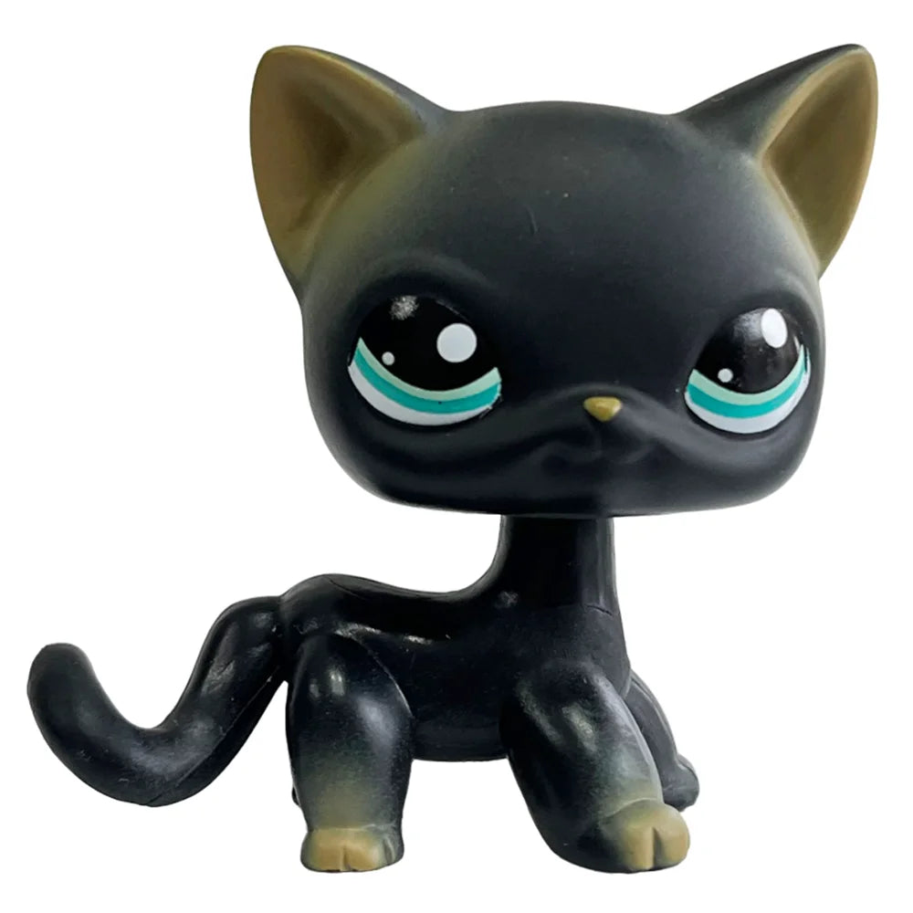 A black bobble head figurine of a cat with light blue eyes and ears.
