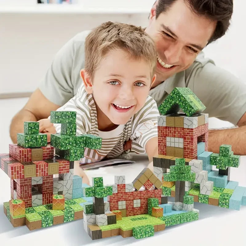 A young boy is smiling while building a miniature landscape using colorful magnetic building cubes.