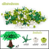 A set of green and white building blocks shaped like a cherry blossom tree, including 7 units.