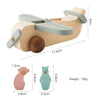 A wooden train toy featuring a glass bead, shaped like a bird, used for Montessori educational play.