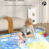 A large blue magic water canvas mat for kids featuring various doodle designs and pens on a table.