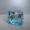 A clear blue ice-like block filled with colorful squishy stress balls and silver stars.