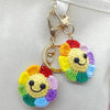 Handmade crochet sunflower decorative smile orb with gold-toned jewelry findings