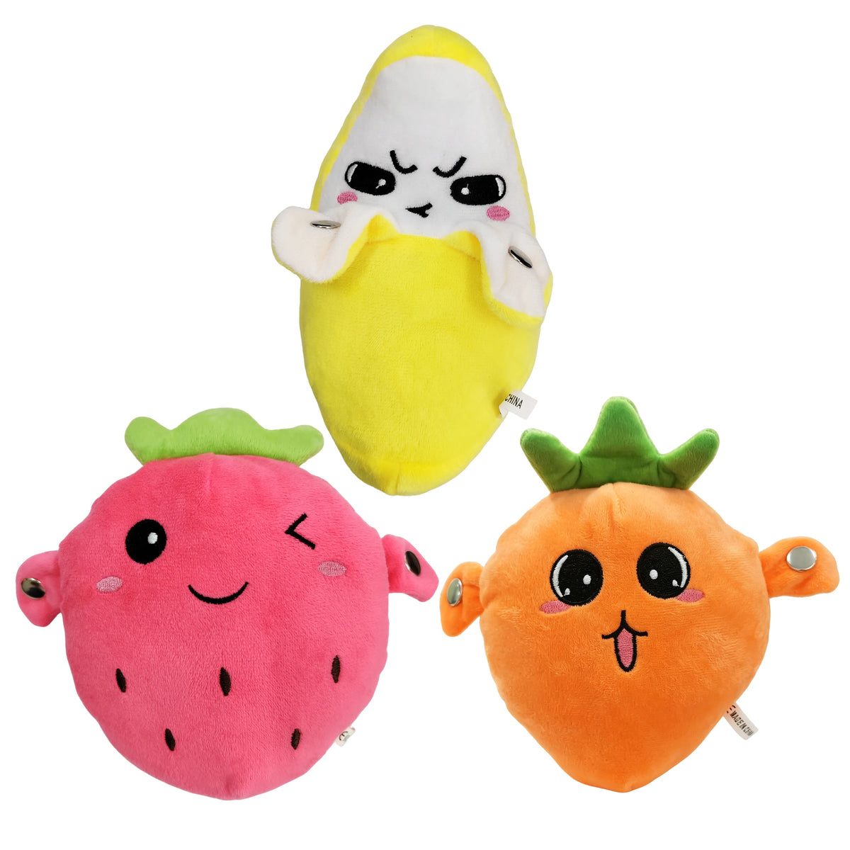 Zwei Plüschpuppen mit Musik, eine gelbe Banane und eine orange Karotte.
