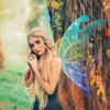 A young woman with long blonde hair is looking at the camera, surrounded by glowing blue fairy wings.