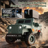 A green 1:64 scale RC Jeep Willys 4WD off-road crawler driving through dusty terrain.
