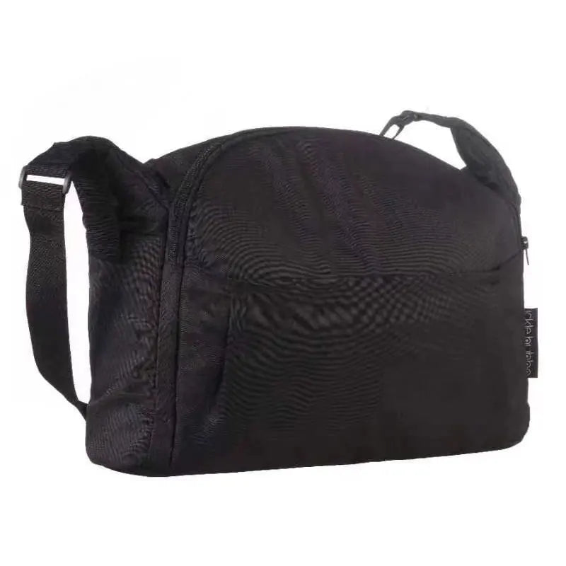 Black stroller accessory kit featuring a mosquito net, rain cover, and other items.