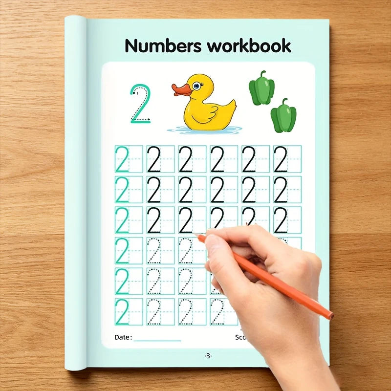 A hand is writing numbers in a workbook titled Numbers workbook, showing tracing practice.