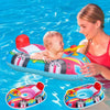 A woman is holding an inflatable car-shaped baby pool float with a safety seat and handles in blue and red colors.