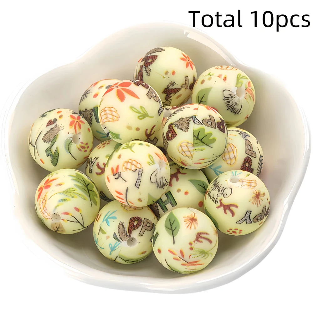 A bowl filled with ten natural-colored silicone beads featuring floral and leaf patterns for DIY jewelry making