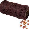 A roll of dark brown natural cotton macrame rope used for crafts and decor.
