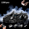 A black 1:14 scale RC sports car building kit with various components and a remote control model being held by a hand.
