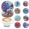 A set of DIY diamond art coasters featuring various colorful animal designs on a white ceramic cup.