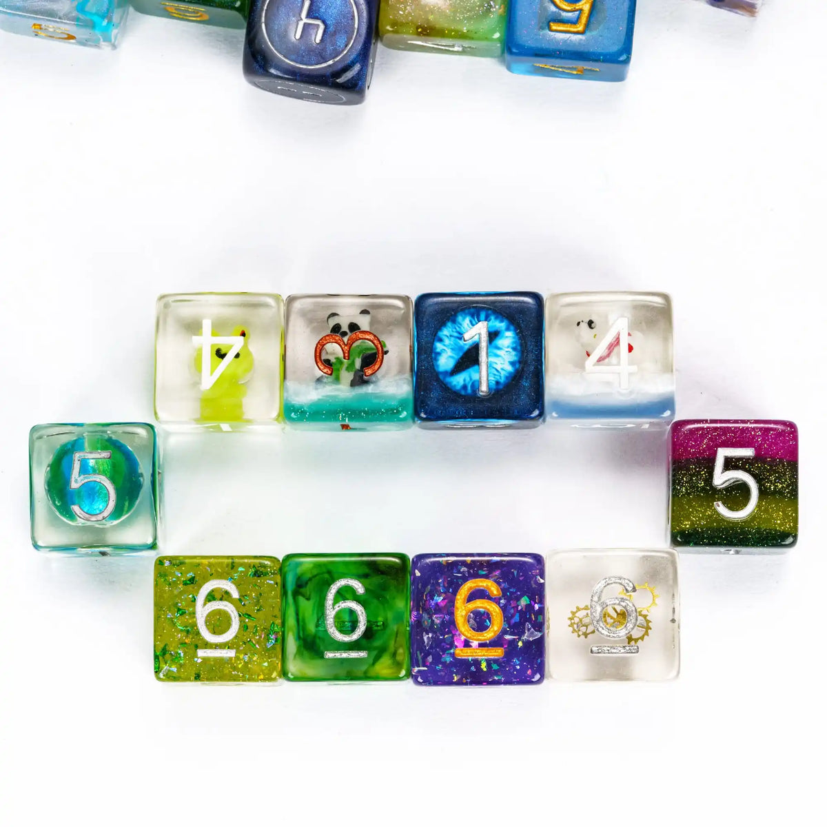 A collection of seven polyhedral resin dice in various colors and numbers arranged in a row.
