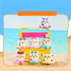 A collection of Chiikawa summer swimming ring plush keychains and charms displayed on a yellow tray against a blue ocean back