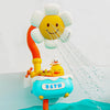 A colorful bath toy set featuring a smiling yellow duck head and an orange sliding track pouring water into a blue tub.