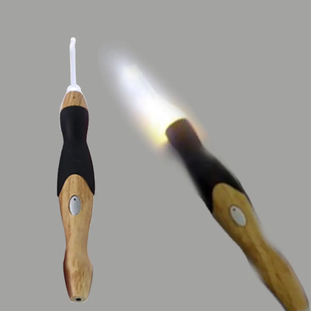 A wooden LED crochet hook is shown emitting a bright white light.