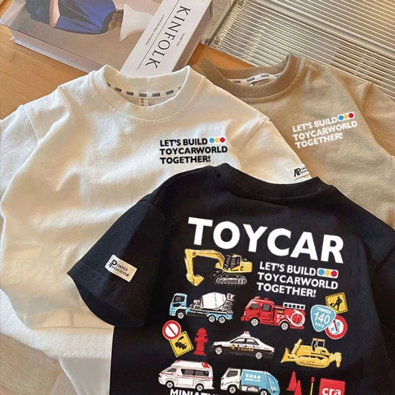 Black crew neck t-shirt with a yellow excavator graphic and text encouraging building a toycarworld together