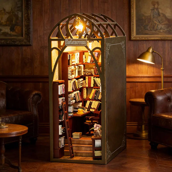A decorative wooden miniature dollhouse kit with an arched glass display featuring bookshelves and furniture.