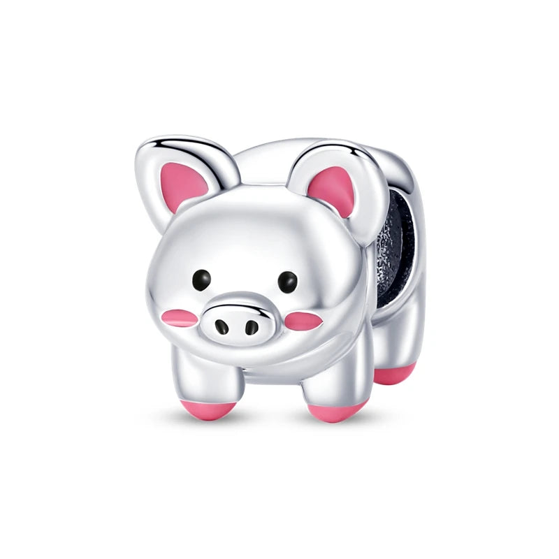 A silver heart charm bead shaped like a pig with pink accents.