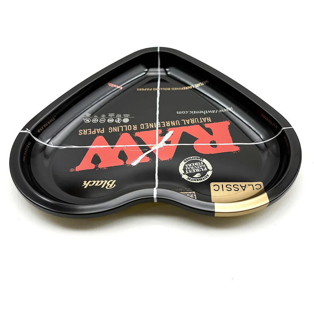Black love-shaped metal rolling tray with a natural unrolled papers insert