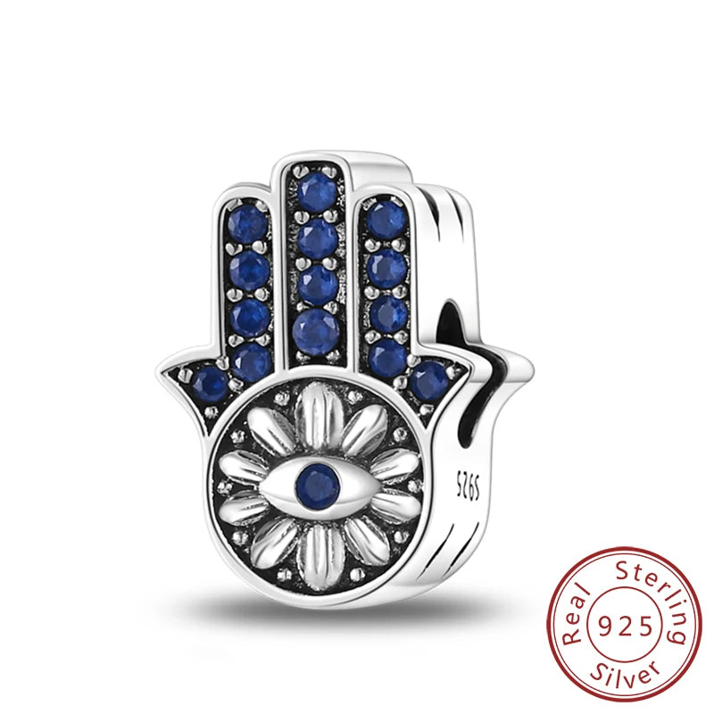 Sterling silver charm beads set featuring cross, angel, and evil eye designs for DIY jewelry making