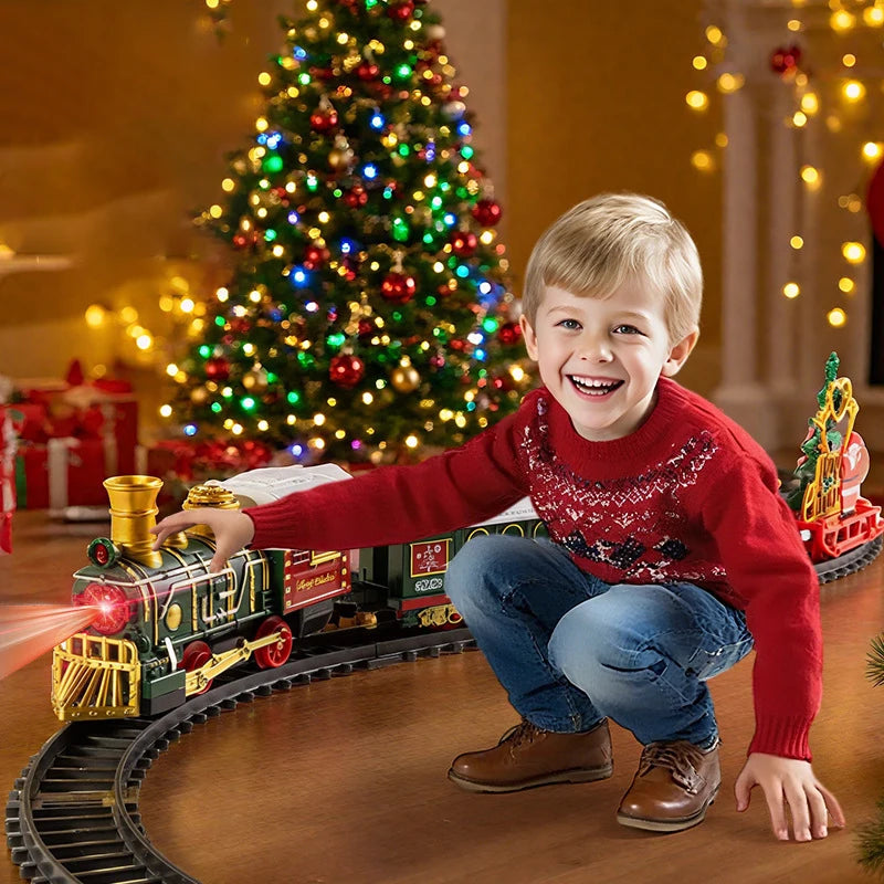 A smiling young boy plays with a musical Christmas train set featuring Santa and a snowman on a wooden track.