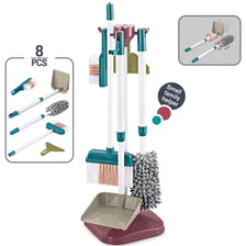 A pink and white kids pretend play cleaning set with a storage rack and various cleaning tools.