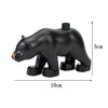 A black elephant shaped building block with a hole on top, shown from the side.
