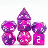 A set of seven glitter translucent polyhedral dice in various shapes and colors