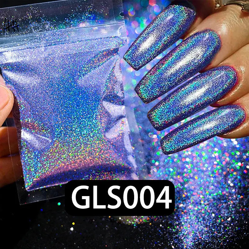 A hand holds a bottle of holographic rainbow nail glitter and several long, iridescent purple nails showcasing the finish.
