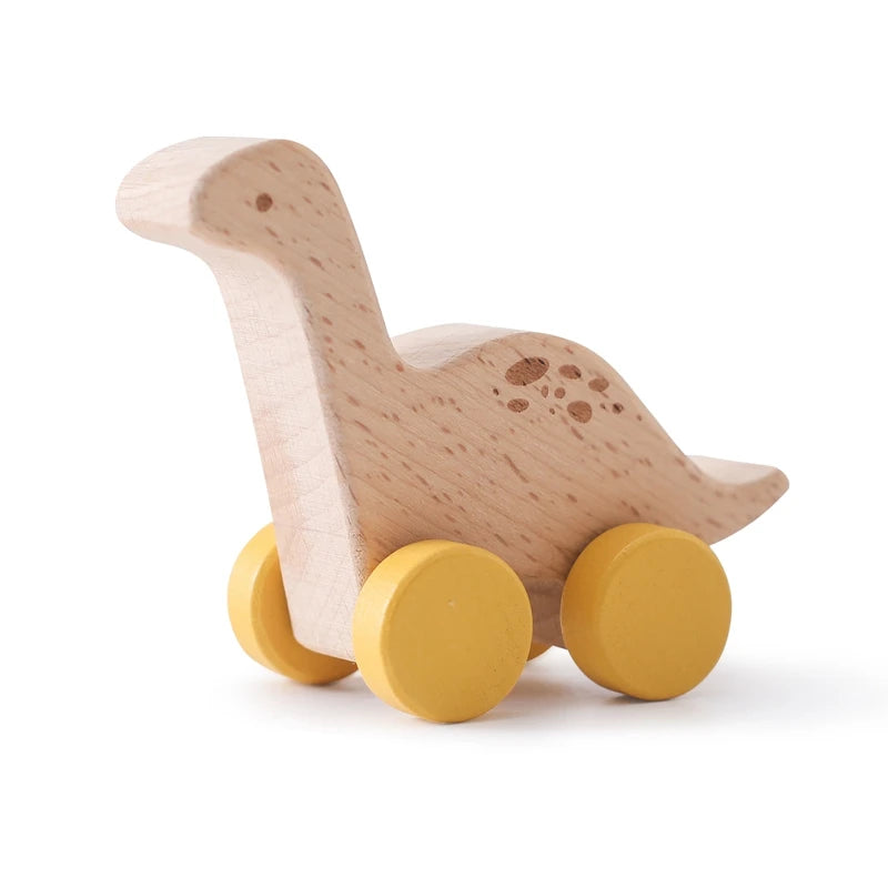 A wooden dinosaur toy car with yellow wheels and textured skin for baby teethering.