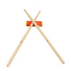 Pair of professional maple wood drumsticks crossed with an orange cylindrical object.