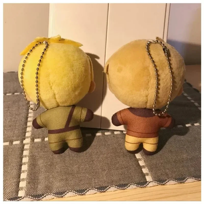 A set of three yellow and brown plush keychains featuring the characters Arthur, Alfred, and Wang Yao.