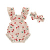 A light pink baby girls summer romper set with matching ruffled headband featuring a red cherry print.