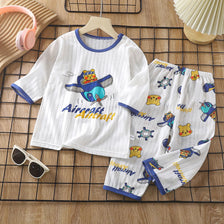 White long sleeve cotton pajama set for kids featuring an aircraft print and various animal motifs