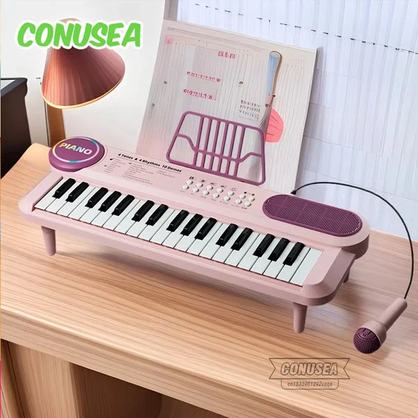 A pink electric piano with a microphone and music kit is displayed on a wooden table.