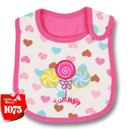 Pink baby feeding bib with a white background and hearts, featuring a swirl design.